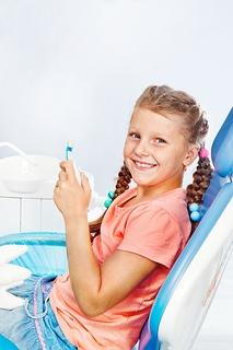 Girl in dental chair image